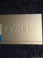 Top view showing Zyxel logo on metallic housing