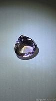 Top view of pear-cut ametrine showing colour zoning