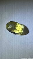 Top view of faceted oval lemon citrine