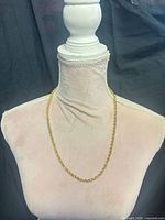 full view of necklace displayed on bust