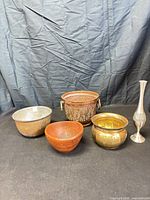Group shot of five vessels showing materials and forms