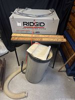 Front view of Ridgid AF3000-0 unit with accessories