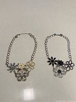 Both necklaces side by side showing full design and chain style