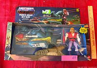 Full boxed set showing Prince Adam figure and Sky Sled inside opened window box
