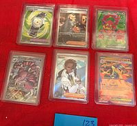 All six sleeved cards: Counter Gain, Philippe, Volcanion EX, Drapion, Naveen, Mega Charizard Y EX