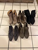 All five pairs of ankle boots laid out together