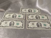 Fronts of five Series 1976 $2 notes