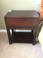 Front view of one nightstand showing top drawer and open shelf, dark walnut mocha finish, clean lines.