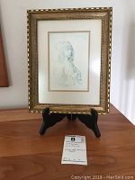 Framed print of Albrecht Durer self-portrait on a black easel, documenting full framed presentation.
