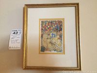 Full view of the framed lithograph with white mat and gold painted wood frame, showing the abstract and colorful artwork.
