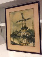 Full view of framed windmill drawing leaning against a shelf, showing the overall composition and frame.