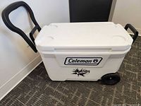 Overall view of Coleman wheeled cooler with handle