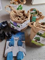Overview of all items: four burlap grow kits, gloves, cooling towel
