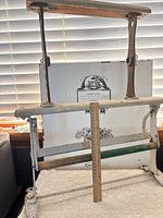 Front view of complete wrapping paper holder with ruler for scale