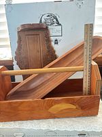 Caddy, dough bowl and wall shelf grouped with ruler for scale