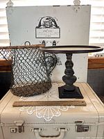 Overall lot view: pedestal cake stand and wire basket together