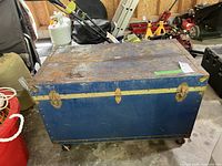 Full view of blue steamer trunk lid and hardware