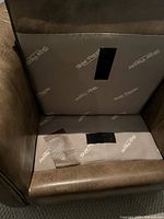 Underside of seat cushion showing Velcro strips and leather wear