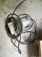 Top view of Campbell Hausfeld PowerPal compressor with coiled power cord