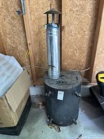 Full view of stove with vent pipe