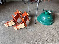 Pair of orange Workhorse brackets with wood blocks and green tree stand