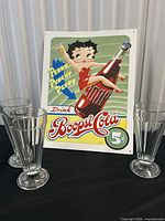 Front view of Betty Boop Boopsi Cola metal sign with three glasses