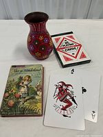 All three items together: book, vase, boxed deck and sample cards