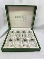 Closed case open displaying eight shakers in satin lining