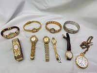 Group shot of all ten watches laid out for identification