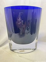 Front view showing cobalt blue body and clear base