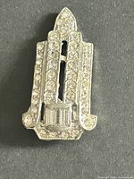 Front view of rhinestone dress clip showcasing overall design and stone layout