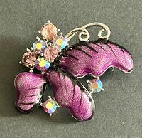 Full view of butterfly brooch showing enamel wings and rhinestones