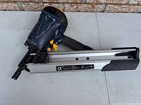 Full view of pneumatic framing nailer showing body, handle and magazine