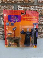 Front view of sealed card showing figure and accessories