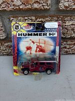 Front view of sealed Fleer Hummer H2 on card