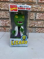 Front view of boxed Funko Wacky Wobbler The Lizard bobble-head
