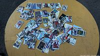 Wide shot of assorted hockey cards spread on table