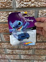Front view of sealed Hot Wheels Disney Stitch Character Car on card