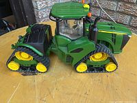 Left side view showing entire tractor, tracks and cab