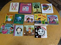 Overview of all 13 board books laid out on table