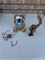All three items: Movie Maniacs display frame with The Thing insert, spider-head creature, tentacled bust