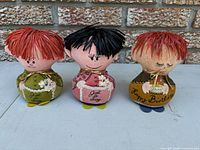 Front view of three Western Union Dolly-Gram dolls