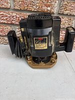 Front view of Skil 1835 Classic router with power cord and handles