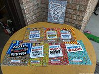 All seven book fronts and slipcase displayed