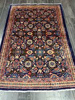 Full view of the Persian Hamadan rug showing overall design and colors