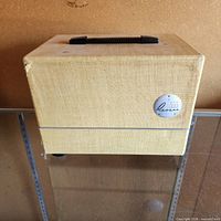 Front view of Revere P-555 projector case showing badge