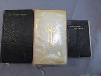 Front covers of all three prayer books