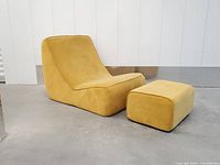 Lounge chair angled view with ottoman front right