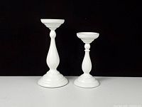 Front view of both graduated pillar candle holders