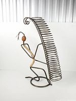 Full view of metal figure CD rack standing